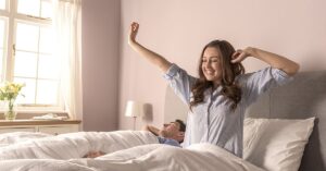 Woman waking up refreshed